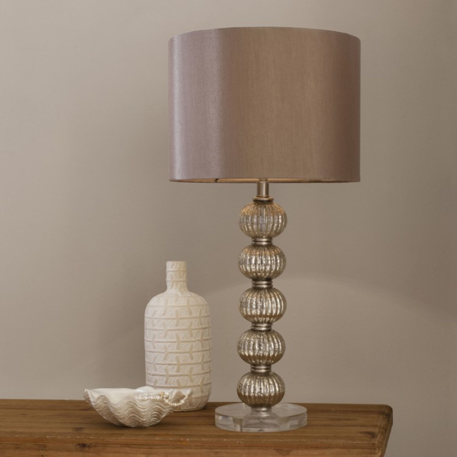 Adriana Table Lamp Elegant lamp with a stacked glass bauble base and dusky rose satin shade.