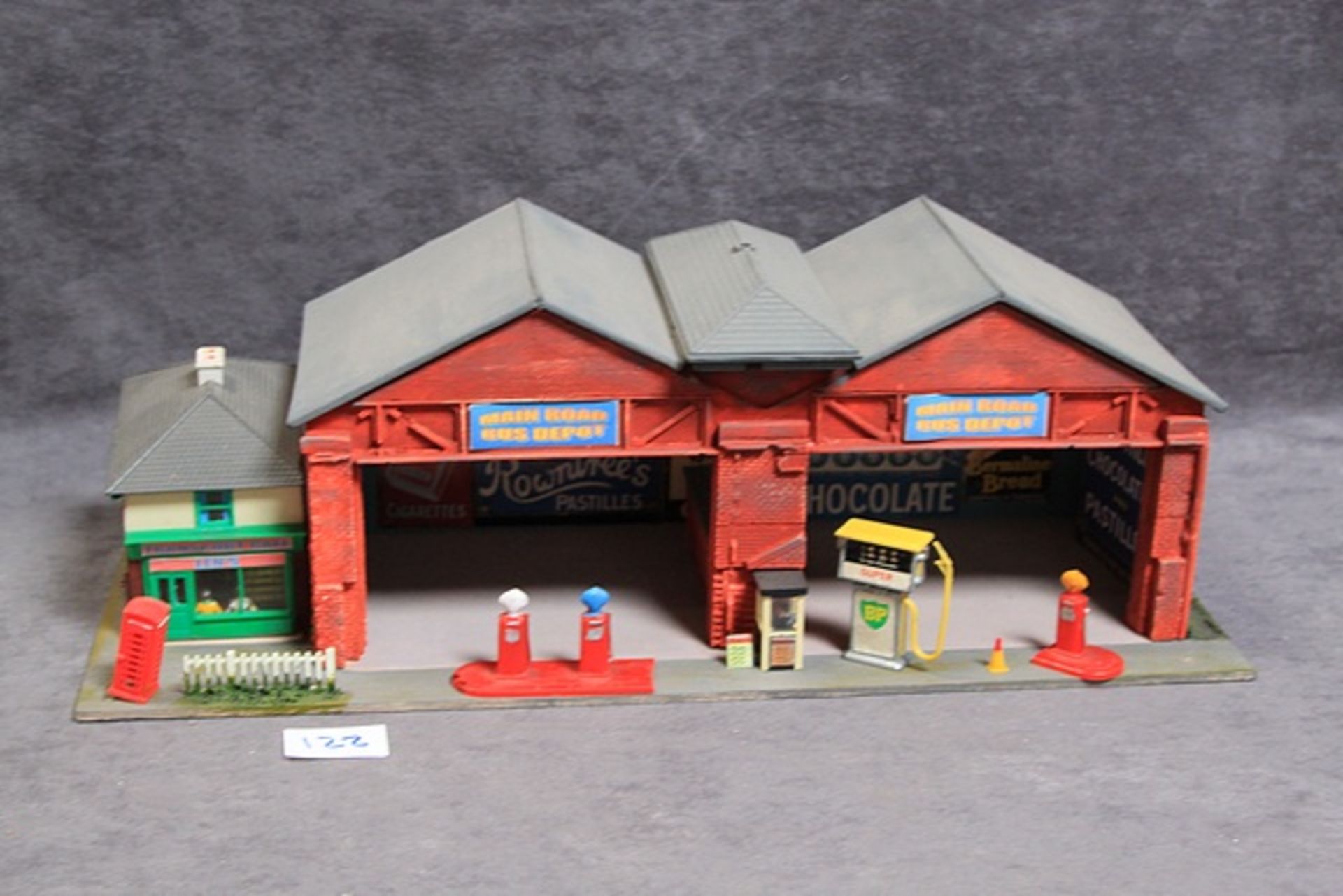 Wood Constructed Model Of Main Road Bus Depot With Petrol Pumps, Figures Forecourt And Transport