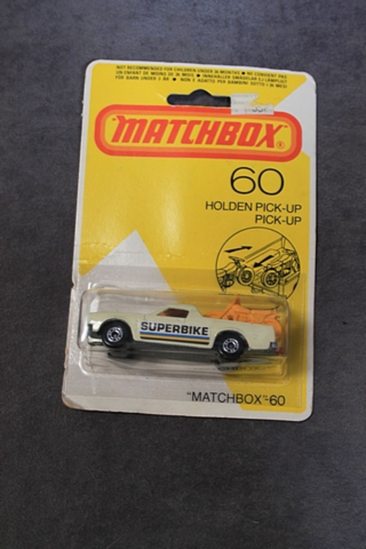 Matchbox Diecast #60 Holden Pick Up Cream Body Superbike Decal With Yellow Bikes Mint On Card - Image 2 of 2
