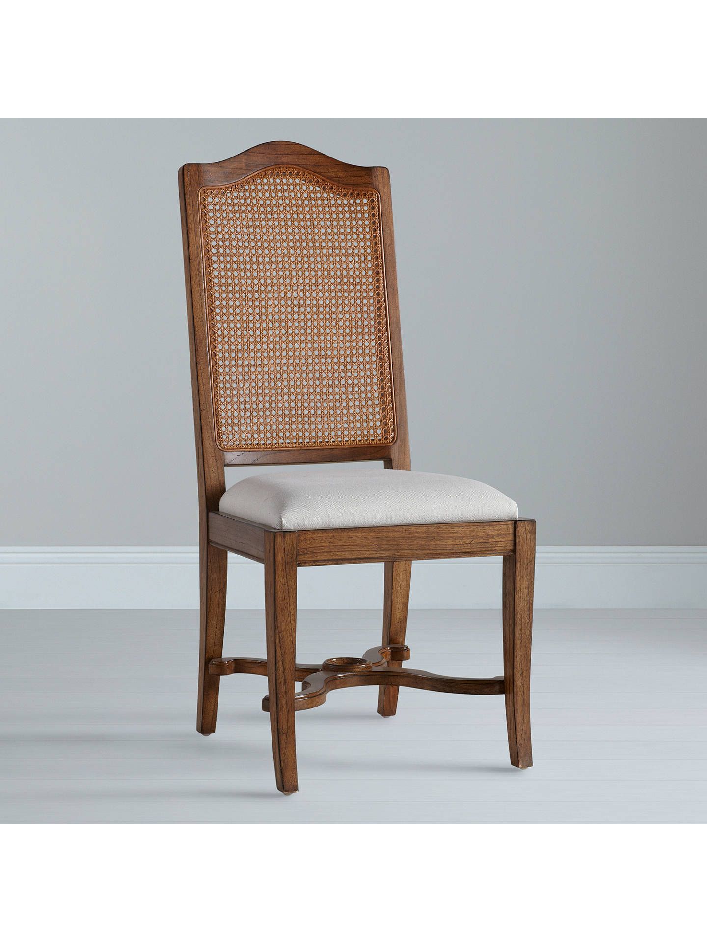 JL Hemingway Cane Back Side Chair This dining chair is made from melia ash and pippy oak veneers.