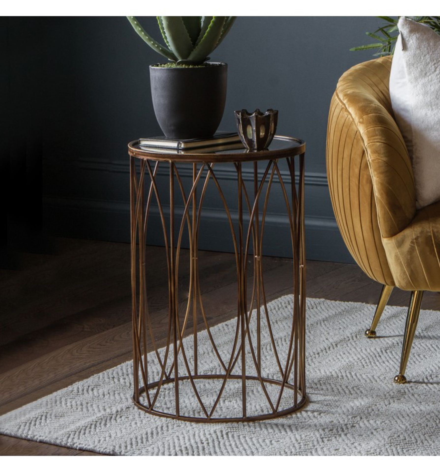 Highgate side table A stylish and practical side table with an antiqued glass top in a bronze effect