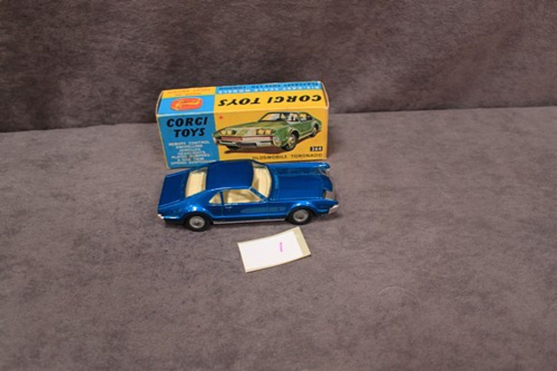 Mint Corgi Toys Diecast #264 Oldsmobile Toronado in metallic blue with leaflet in a excellent firm