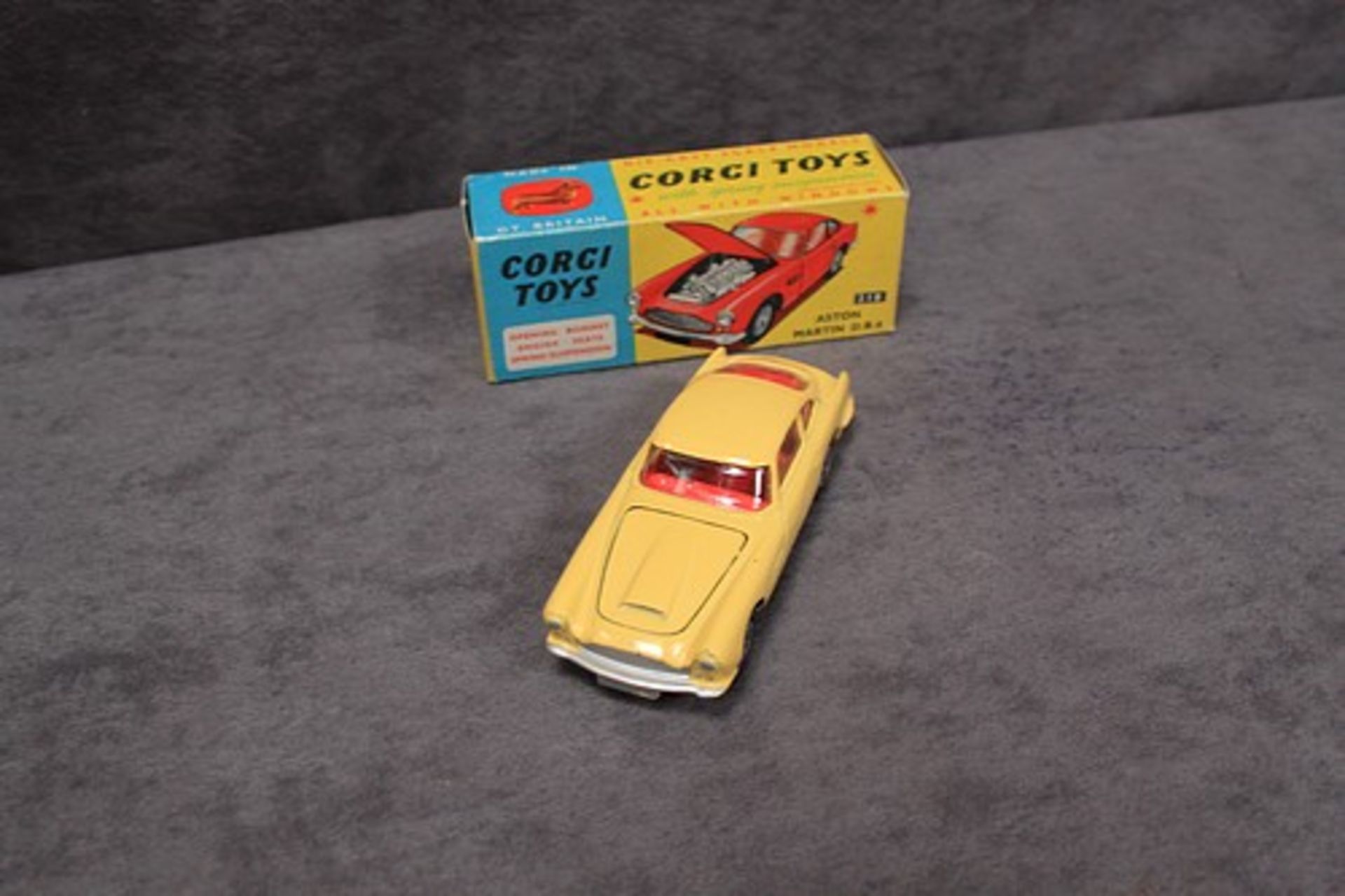 Mint Corgi Toys Diecast #218 Aston Martin DB4 in yellow in a excellent box