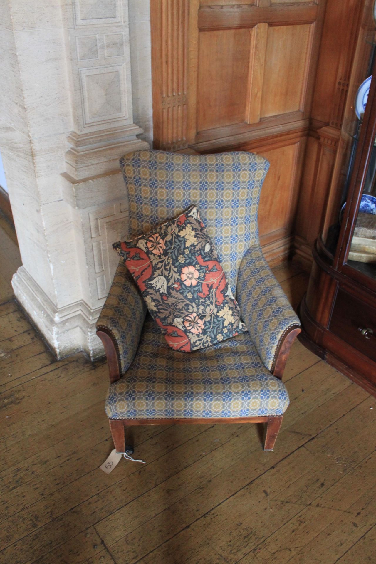 A Wingback Armchair Boasts A Classic Wingback Design Complete With Scrolled Arms On Castors Complete
