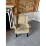 A Pair Of Beige Upholstered Wing Backed Arm Chairs With Solid Wooden Feet 89 x 63 x 100cm