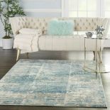 Ivory/Grey/Blue Solace Rug Sumptuous shadings of cool neutral tones in captivating abstract