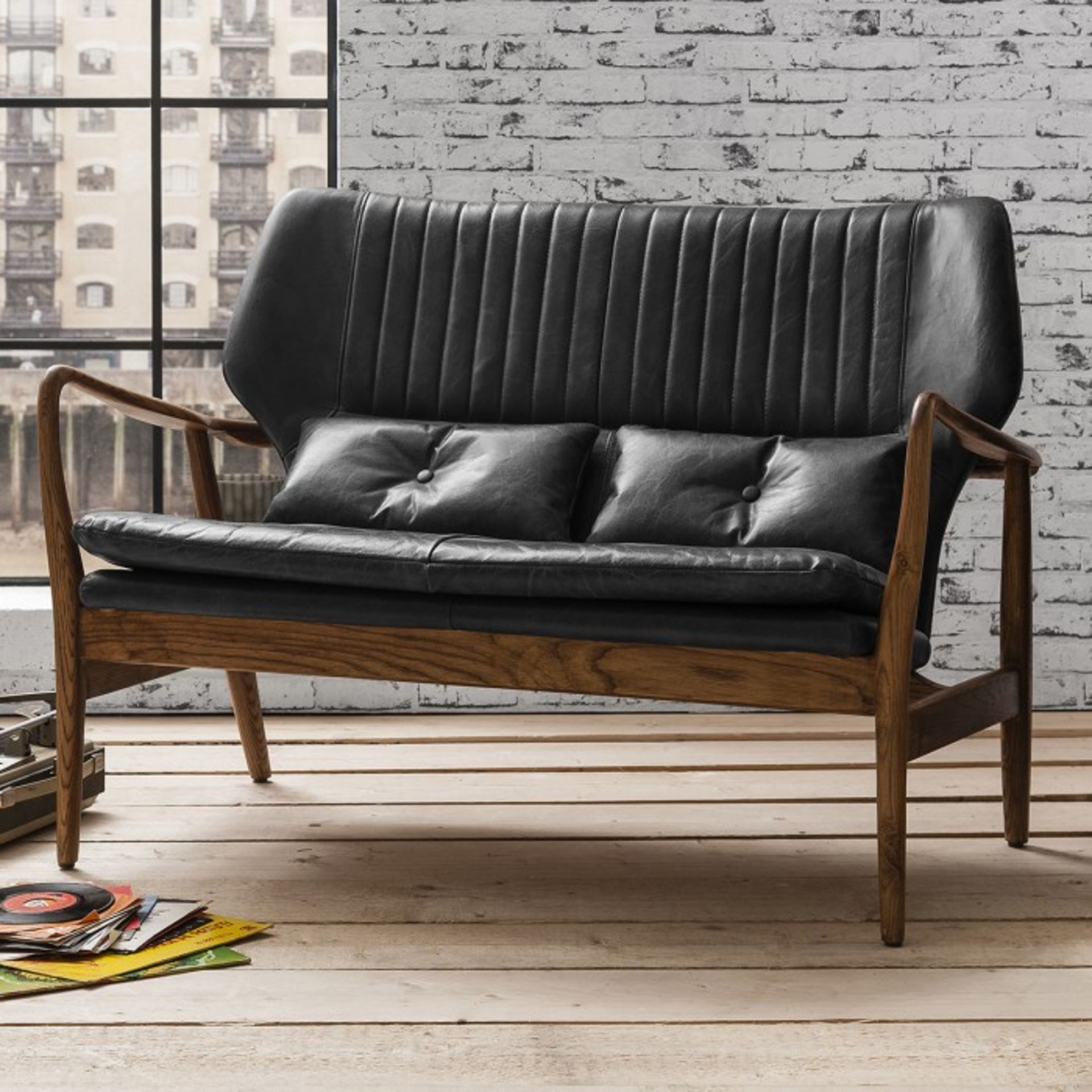 Whitworth Sofa Charcoal vintage leather The beautiful curves and vintage-inspired design of the