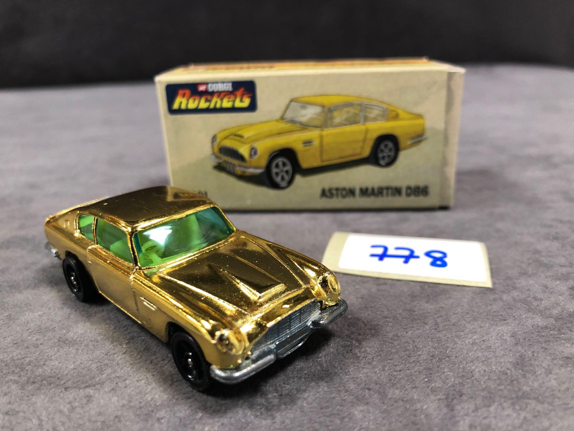 Mint Corgi Rockets Diecast #D901 Aston Martin DB6 In Metallic Gold With Yellow Interior In 'Code