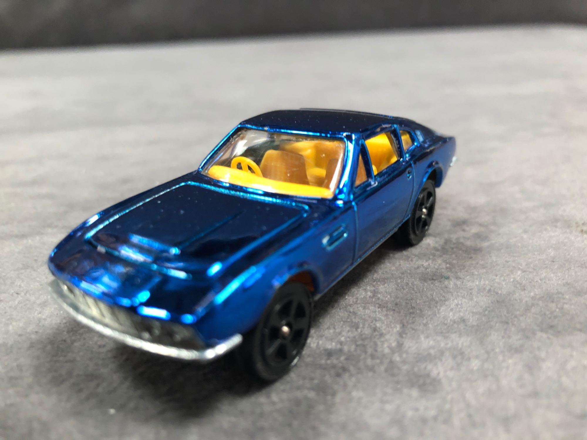 Mint Corgi Rockets Diecast #913 Aston Martin DBS In Metallic Blue With Orange Interior In 'Code 2' - Image 2 of 3