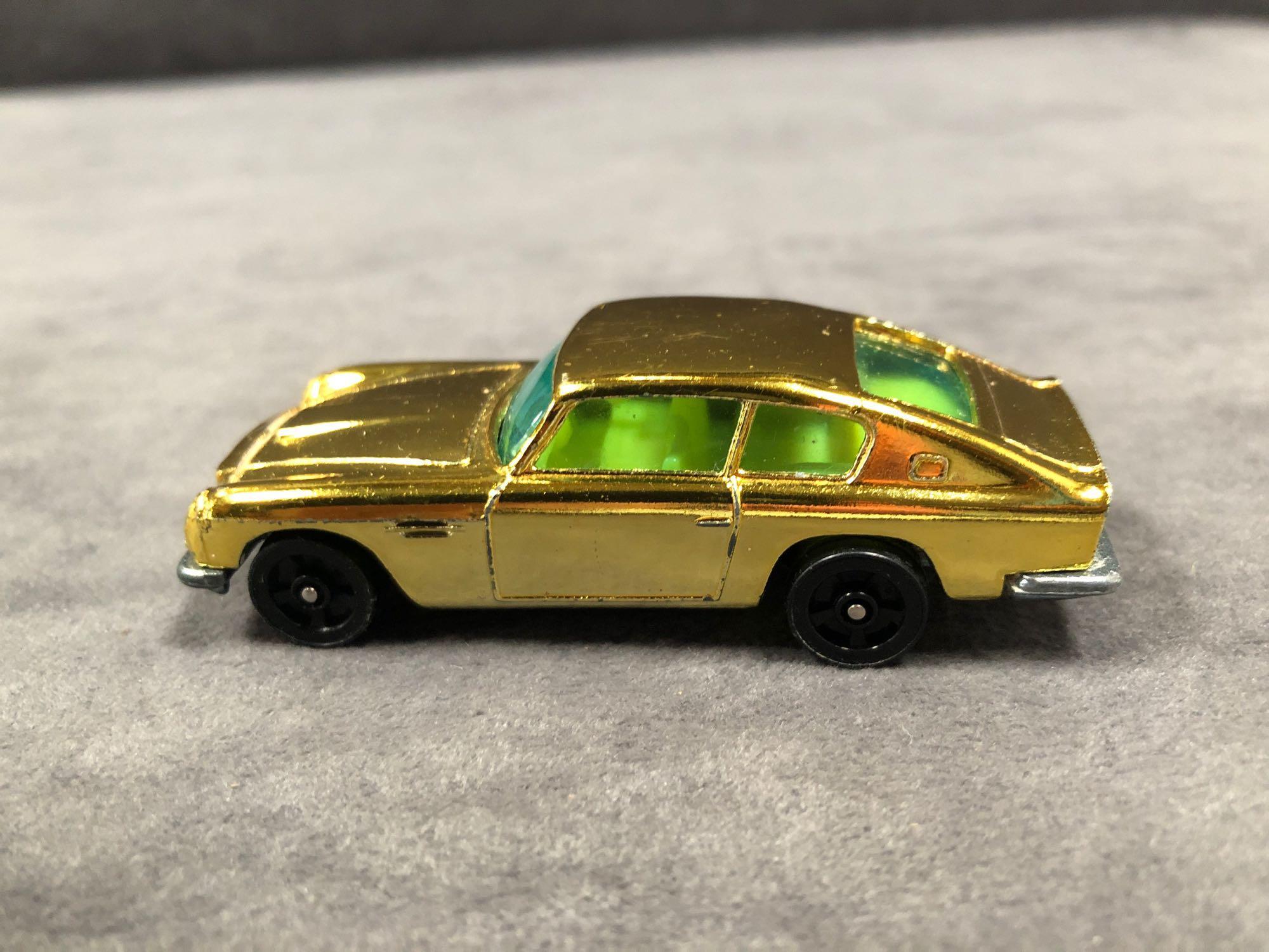 Mint Corgi Rockets Diecast #D901 Aston Martin DB6 In Metallic Gold With Yellow Interior In 'Code - Image 2 of 3