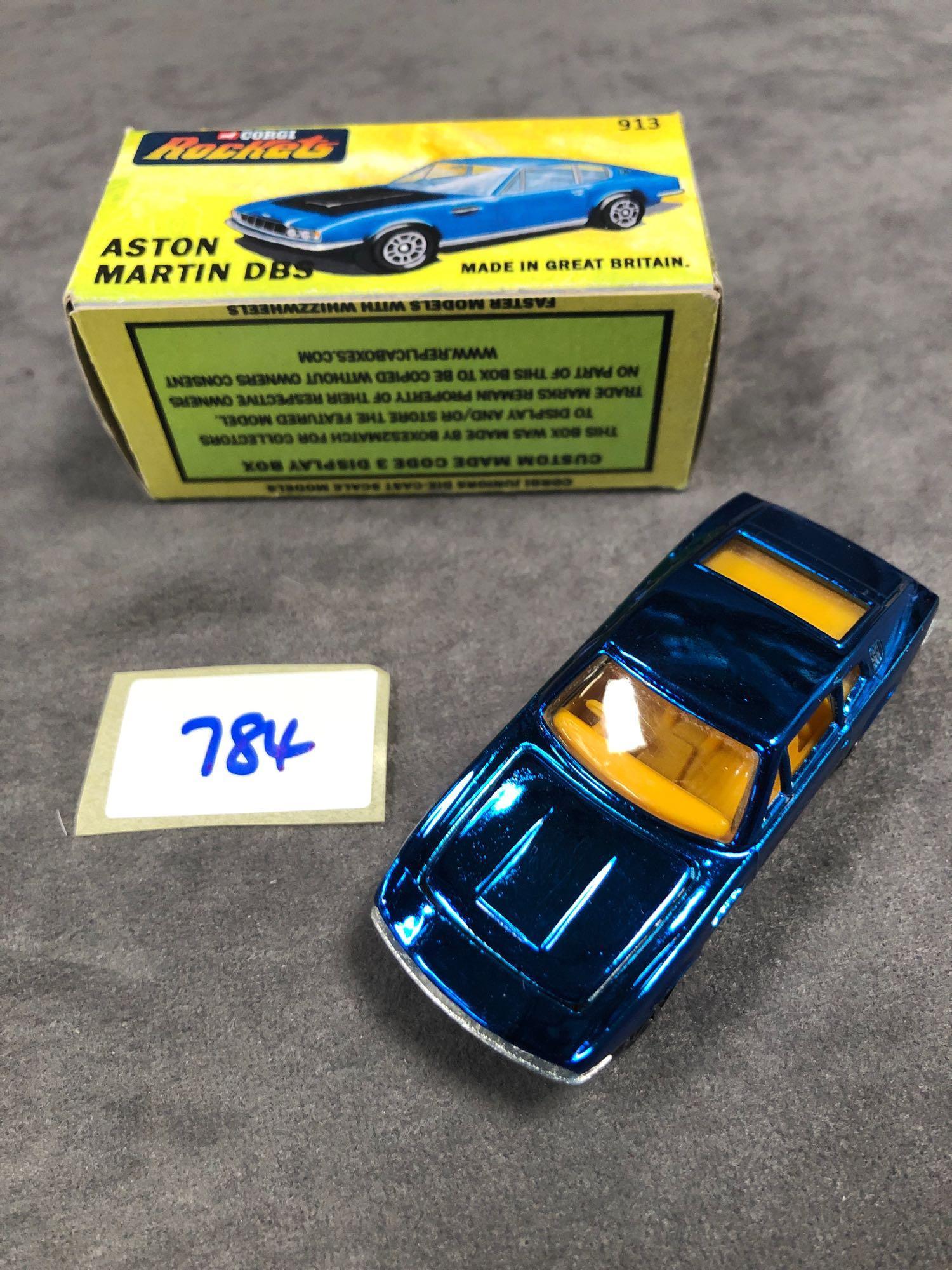 Mint Corgi Rockets Diecast #913 Aston Martin DBS In Metallic Blue With Orange Interior In 'Code 2'