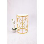 A gorgeous side table finished in a bright gold coating and a stunning white marble top. Style type: