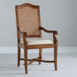 A Pair of John Lewis Hemingway Cane Back Arm Chair Pippy oak features small, tight clusters of