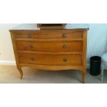 Three drawer chest of drawers with glass top - serpentine shaped front with sabre style front legs