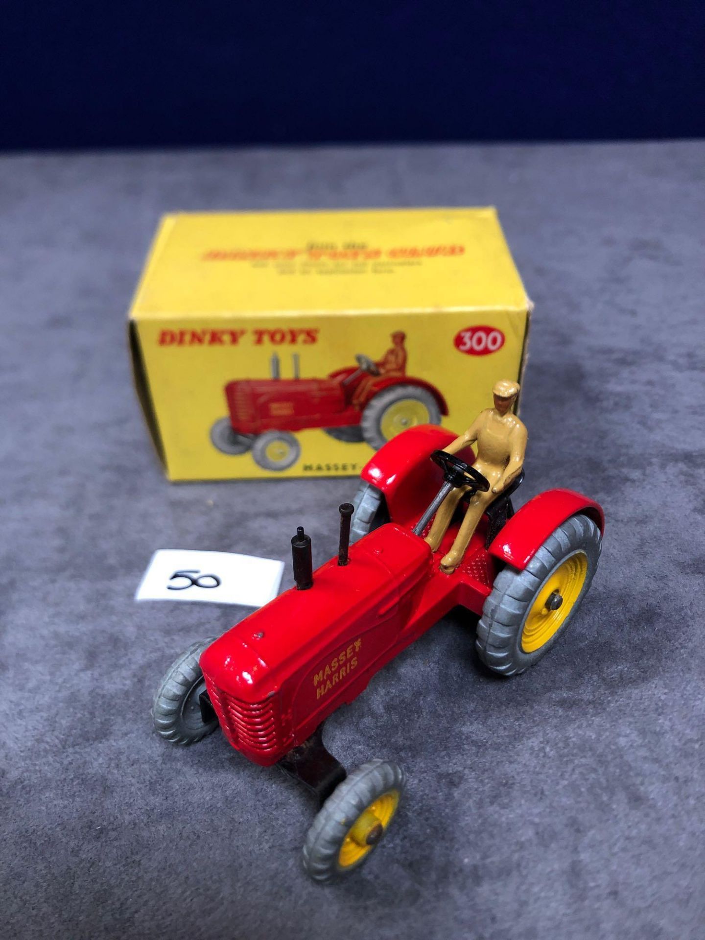 Dinky #300 Massey Harris Tractor mint in near mint slightly soiled box  1966-1971