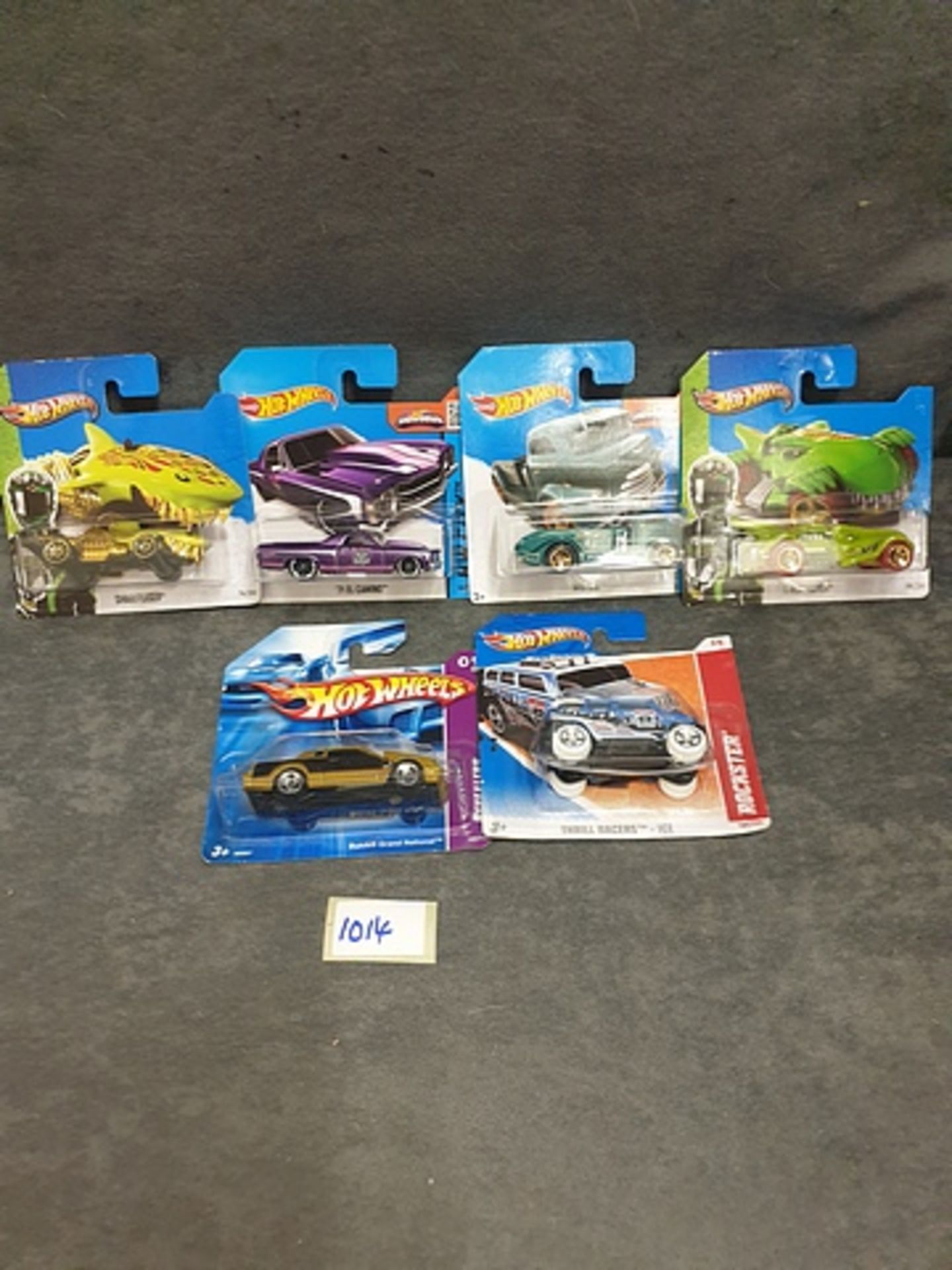 6 X Hot Wheels Carded New Comprising Of #1667 Sharkruiser #1713 T-Rextroyer #M6867 Buick Grand