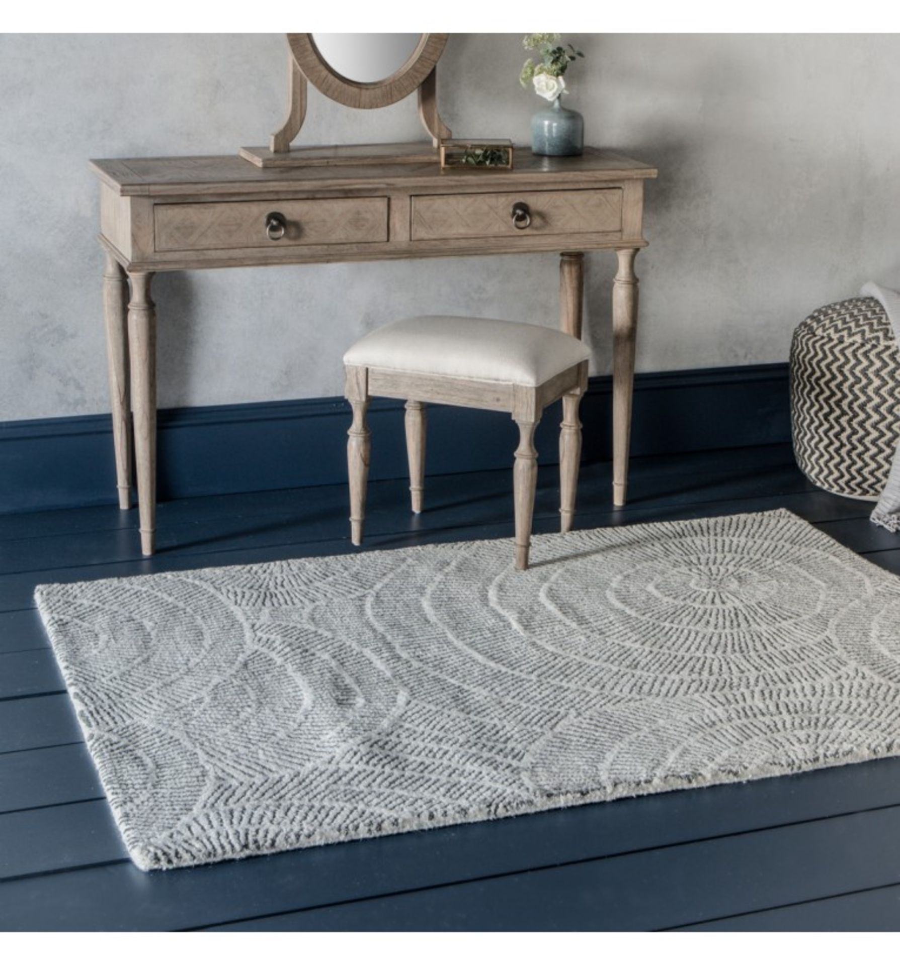 Cortez Rug This rug features a striking starburst pattern in natural tones. Hand-tufted in India