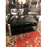 Three tier black glass and metal media unit