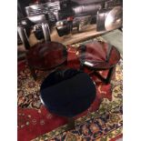 3 x small coloured glass tables with cast metal base. (heavily chipped)