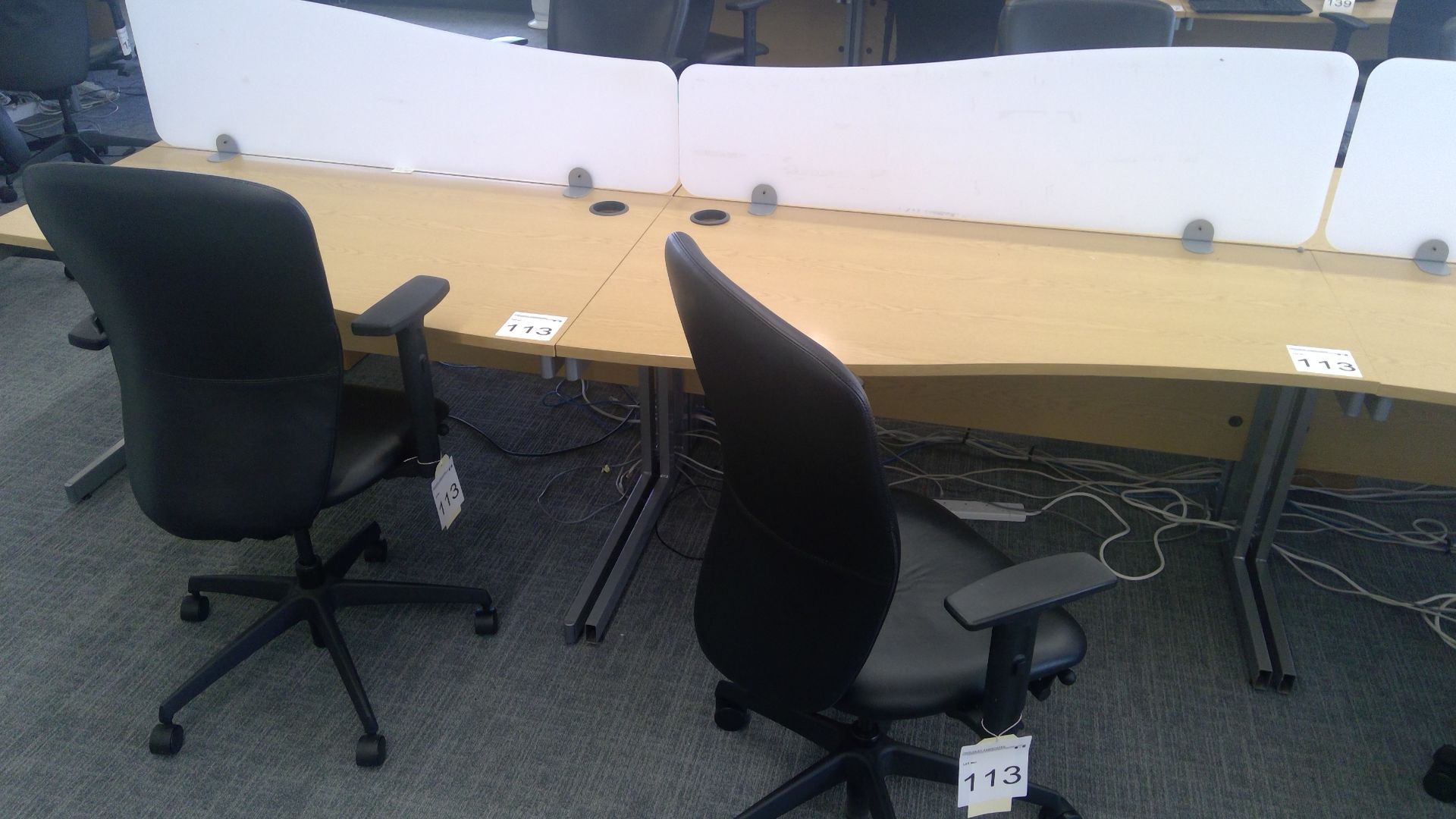 2 No. Oak effect ergonomic desks with opaque desk dividers complete with 2 No. 3 way adjustable gas