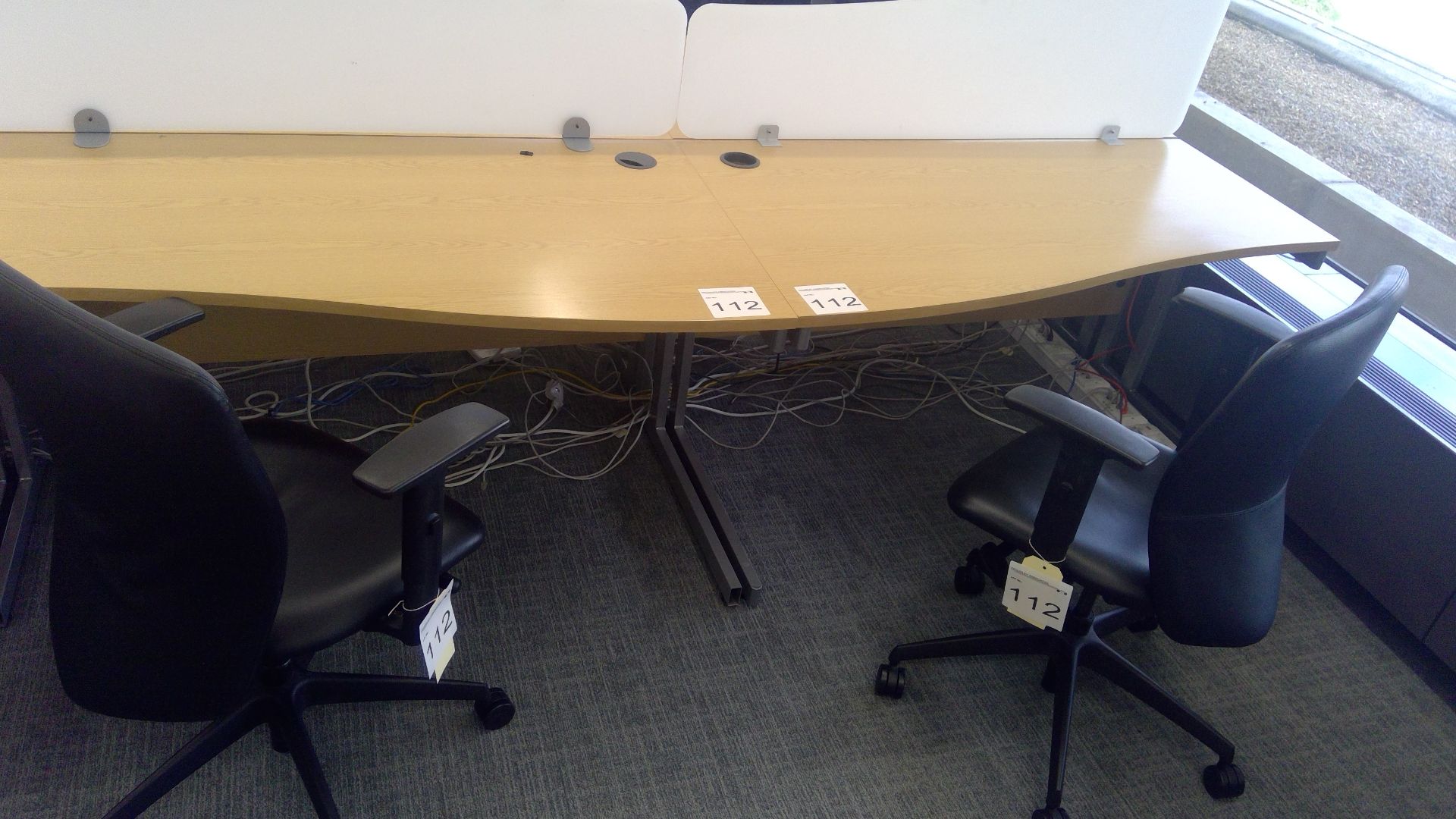 2 No. Oak effect ergonomic desks with opaque desk dividers complete with 2 No. 3 way adjustable gas