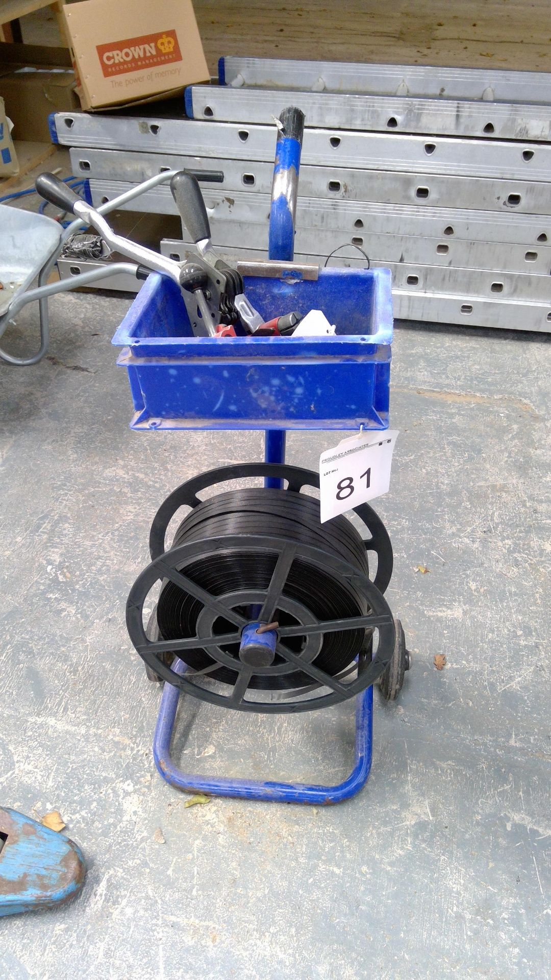 Banding trolley including tensioner and clips