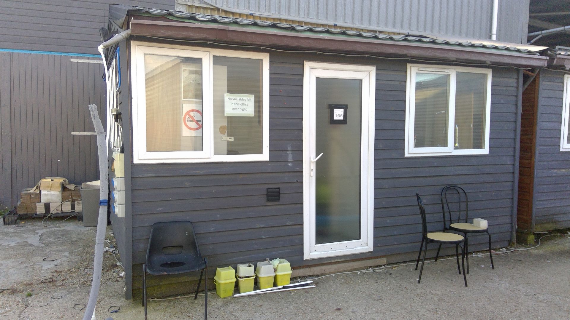 15ft x 10ft timber clad office with double glazed units and door complete with contents to include d