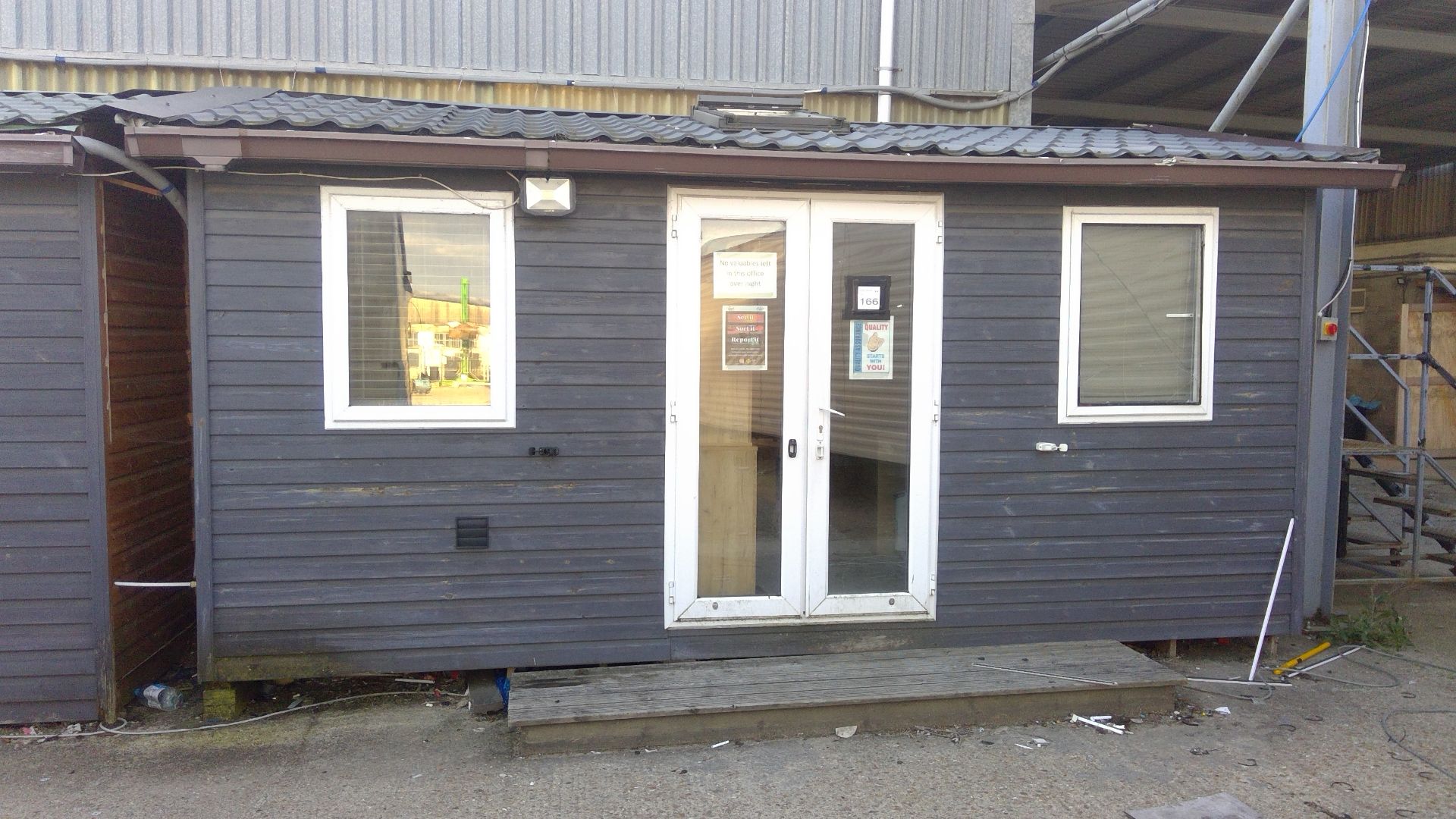 15ft x 10ft timber clad office with double glazed units and door complete with contents to include d