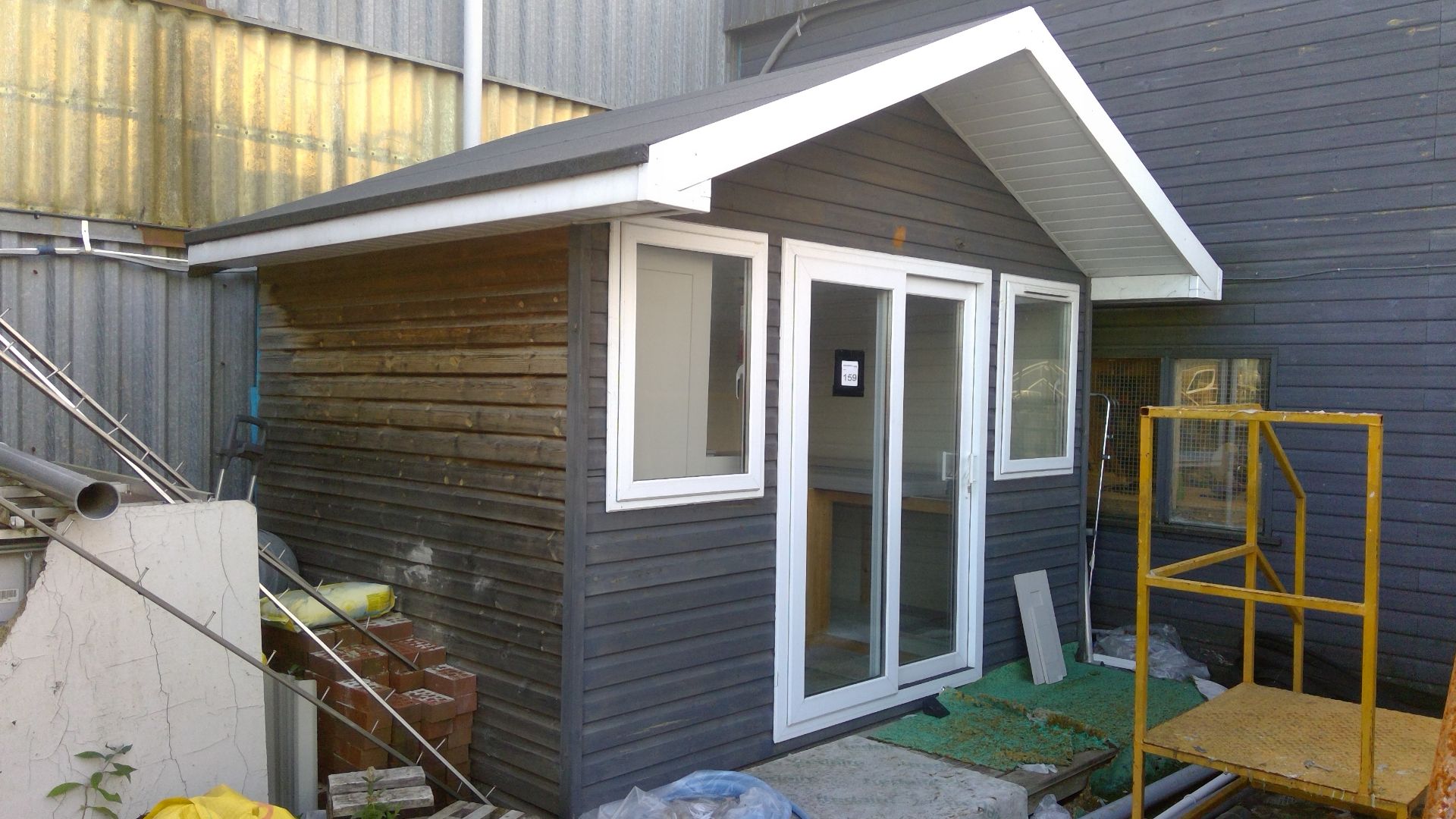 12ft x 8ft Chalet building timber clad with double glazed units