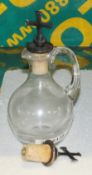 Glass Jug with 2x Religious Bottle Stops