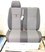 Twin Vehicle Seats With Seat Belts.