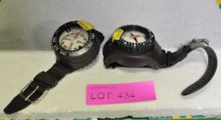 2x Wrist Mounted Compasses.