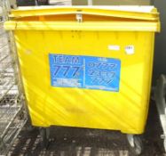 Yellow large wheelie bin