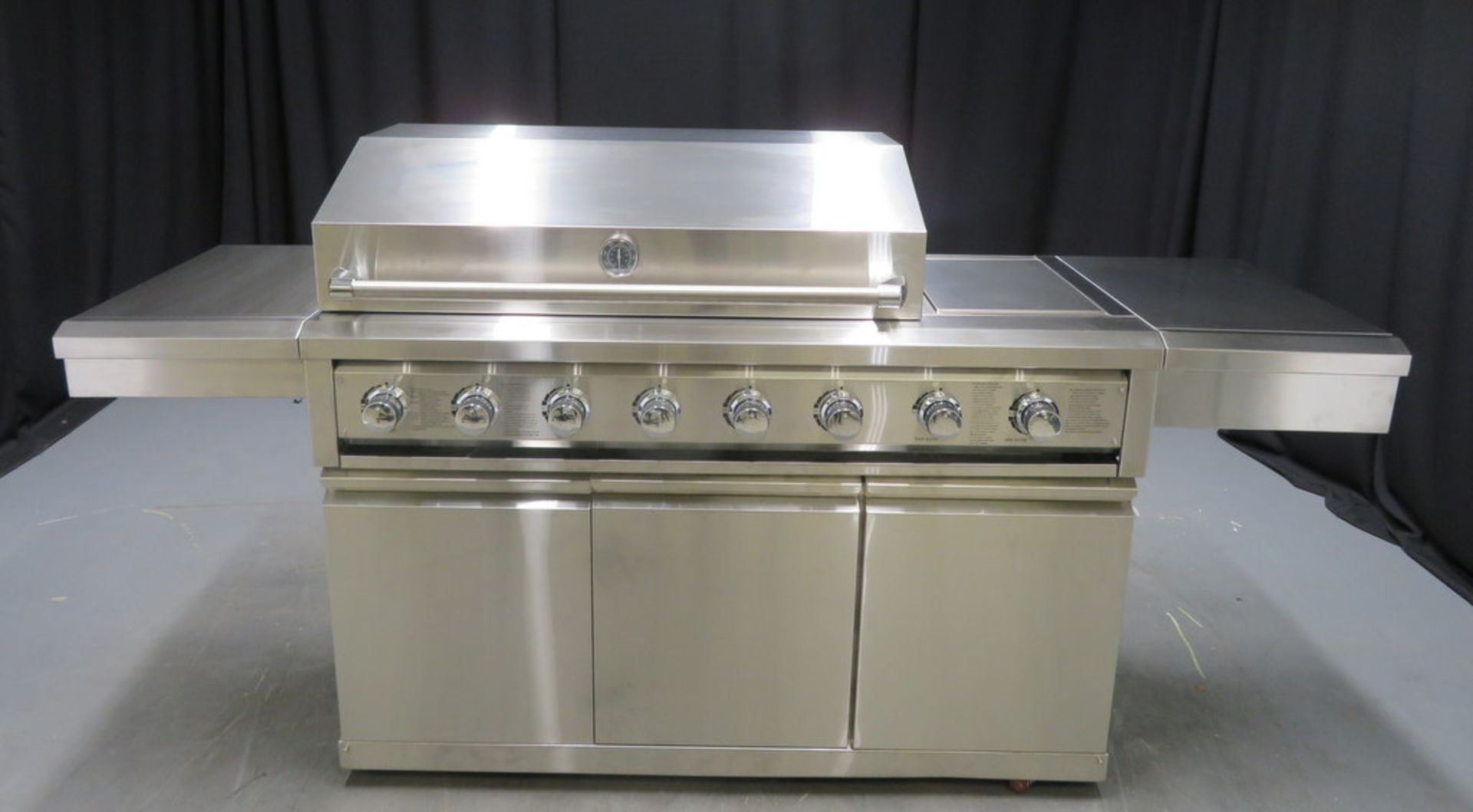 Gas 6 burner BBQ with infrared rear burner & side burner with cupboards, ex display model unused