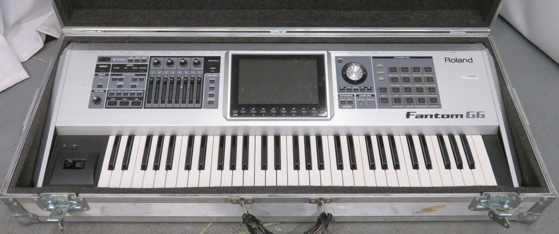 Roland Fantom 66 keyboard in flight case. Serial number: ZY67873.