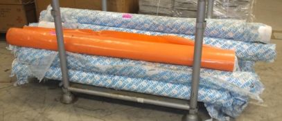 Rolls of Tuffreel plastcu vinyl - white and orange