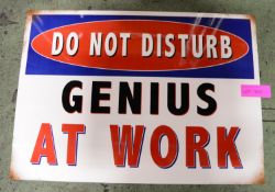 Genius at Work Tin Sign 700x500mm.