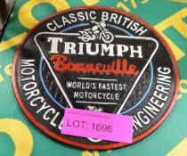 Triumph Cast Sign.