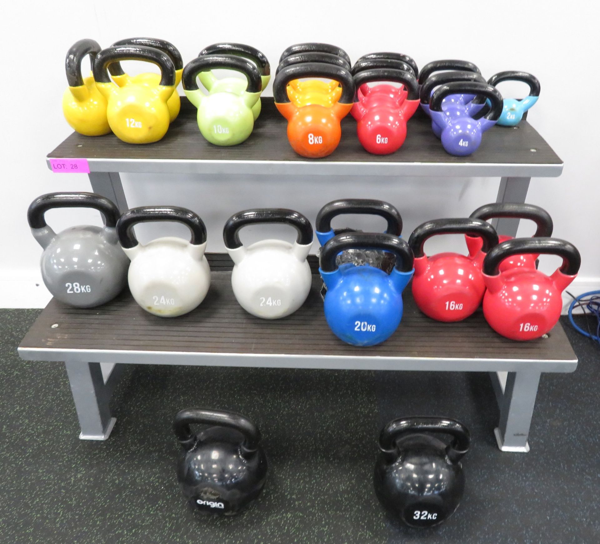25x Origin Kettle Bell Set With Rack. Weights Range From 2kg - 32kg.