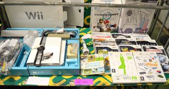 Nintendo Wii Console with various accessories and games
