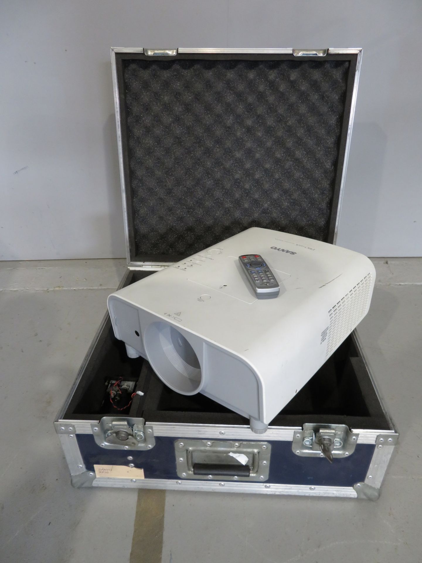 Sanyo XT25 Projector including lens in flightcase. Includes remote. Working condition.