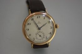 A gentleman's Omega oversized yellow metal wristwatch, the silvered dial with Arabic numerals and