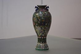 A large Japanese porcelain baluster vase, with a pair of carp handles, the body painted with