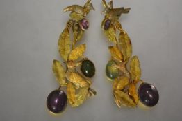 A striking pair of 19th century drop earrings, probably c. 1870, each modelled with exotic birds