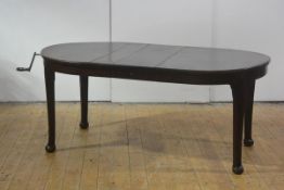 A Whytock & Reid mahogany wind-out dining table, c. 1920/30, the D-end moulded top above a plain