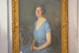 British School, early 20th Century, Portrait of a Young Lady in a Blue Dress, three-quarter