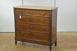 A French gilt-metal mounted marble topped chest of drawers, the rectangular top with rounded
