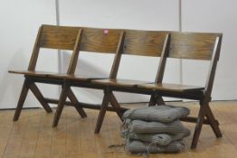 An unusual elm four seat chair back country bench, with moulded back above four folding seats, on