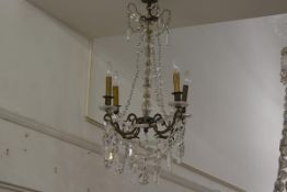 A George III style gilt-brass and cut and pressed glass four-light chandelier, with glass baluster