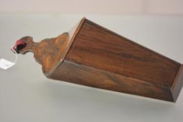 A George III mahogany candle box, of characteristic form, string inlaid and with scroll carved